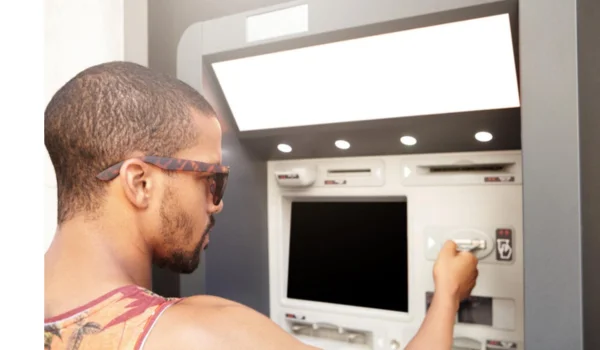 Man Using ATM Machine